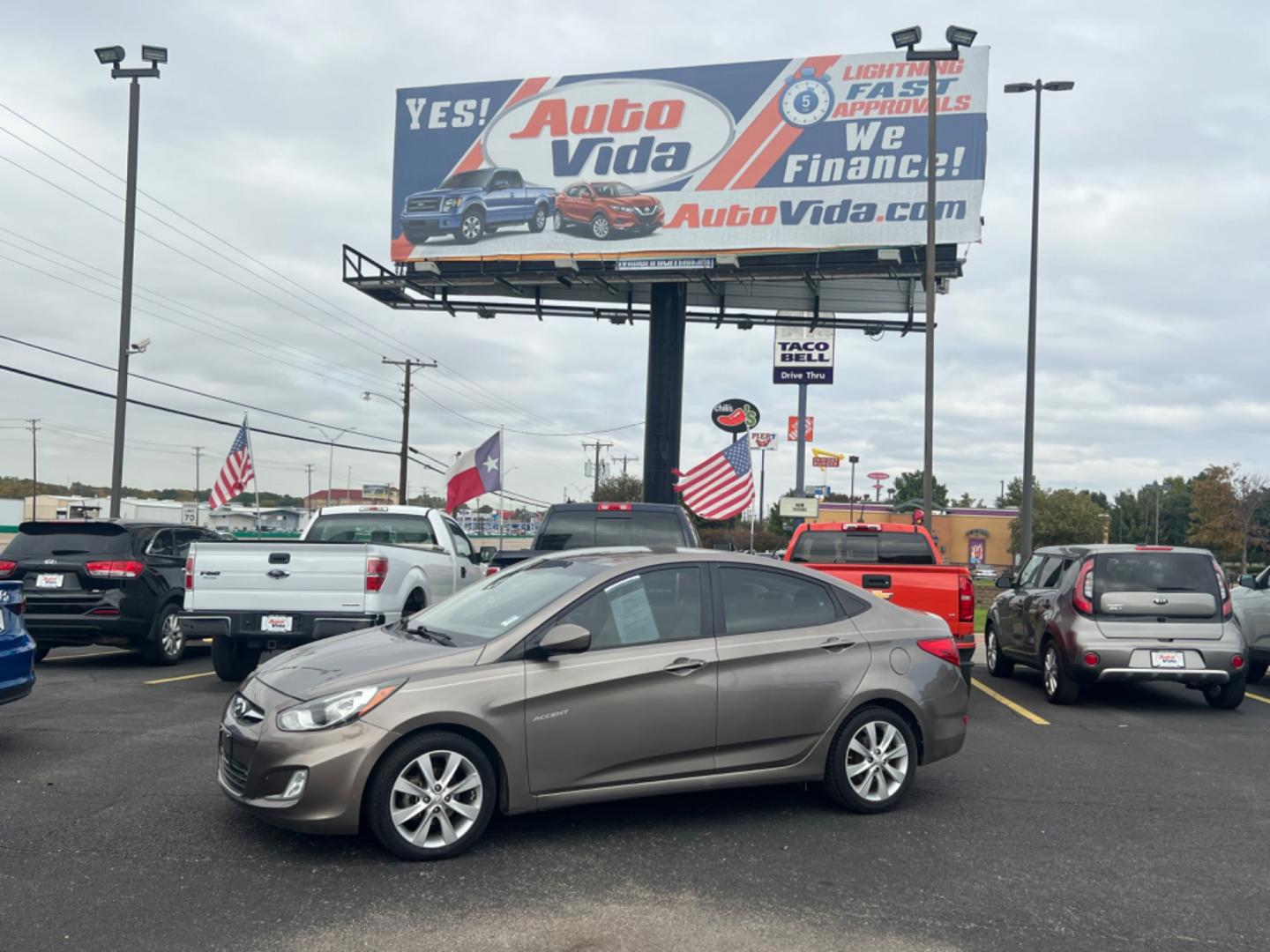 2013 BROWN HYUNDAI ACCENT GLS GLS 4-Door (KMHCU4AE3DU) with an 1.6L L4 DOHC 16V engine, located at 420 I-35E, Lancaster, TX, 75146, (469) 297-4144, 32.593929, -96.823685 - Photo#0